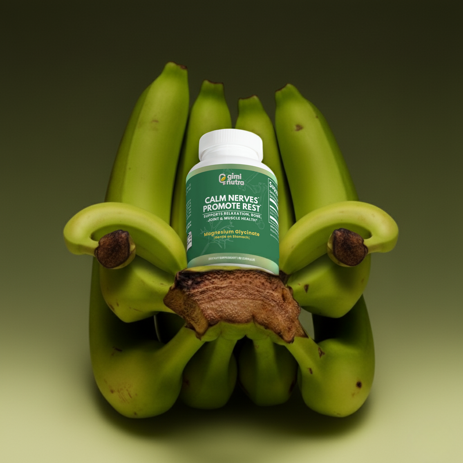 Magnesium supplement bottle sitting on a bunch of green bananas with a green gradient background. 
