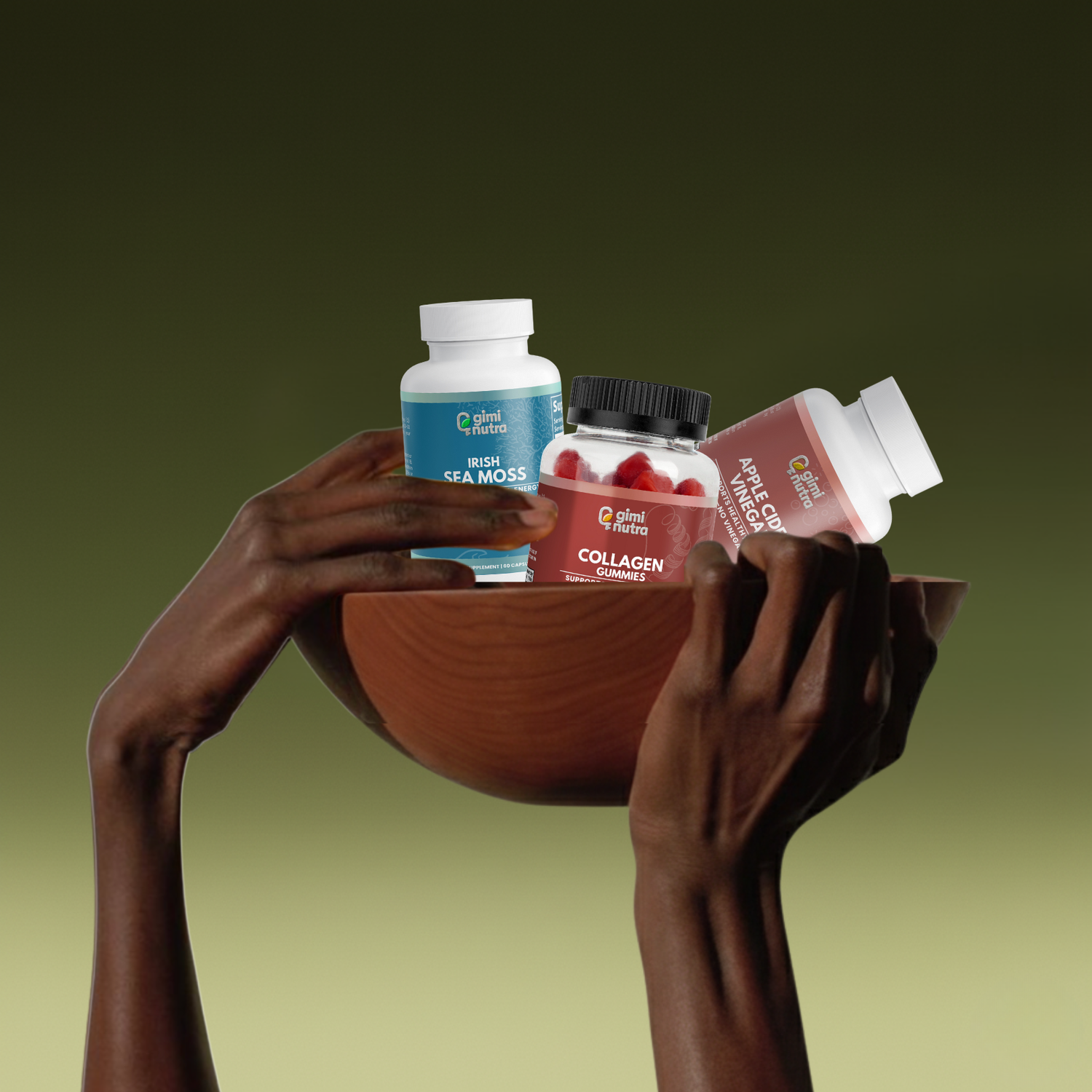 Hand holding wooden bowl upward on a green gradient background. The bowl is filled with beauty supplement bottles.